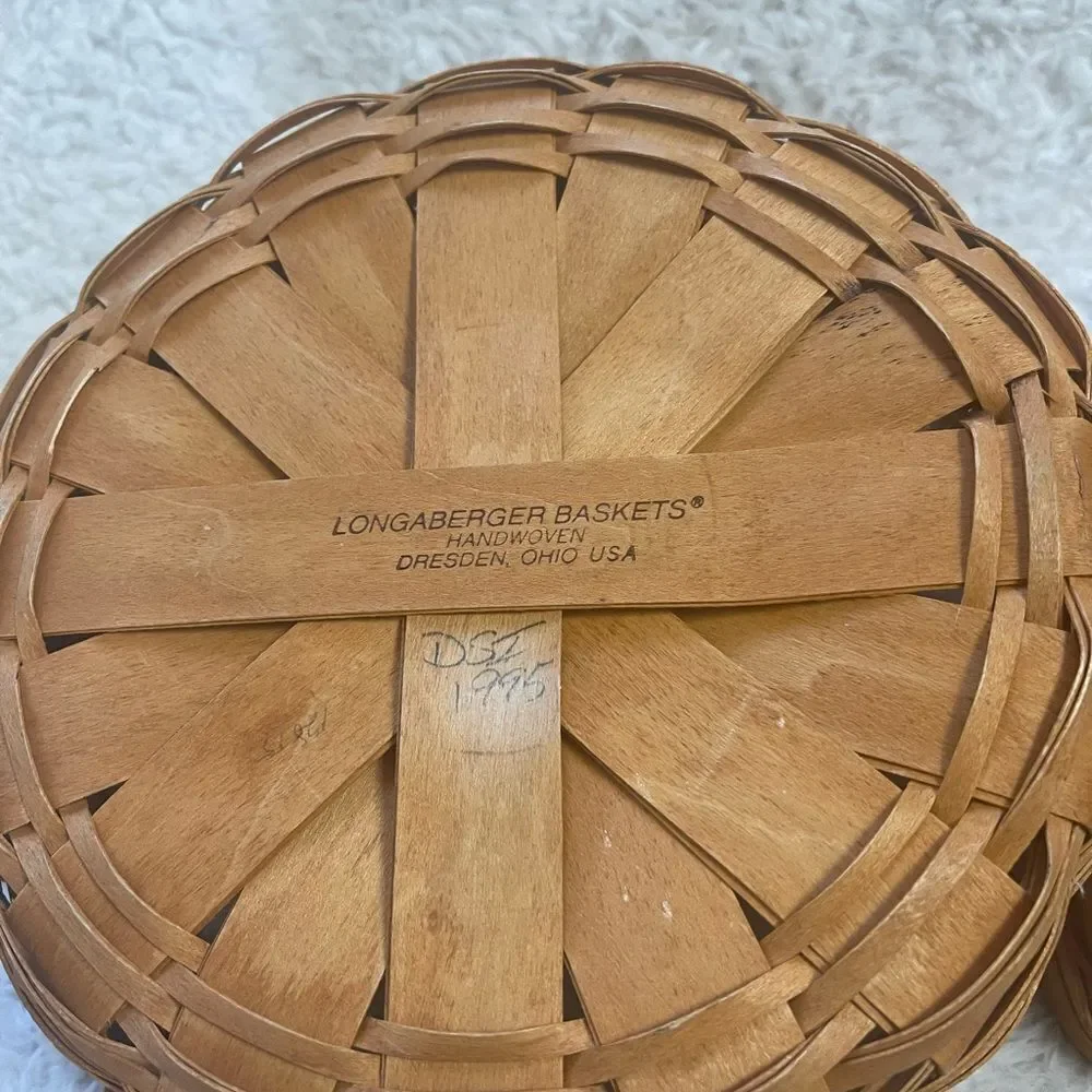 Longaberger 1995 set of two Handcrafted round and Square Woven baskets .